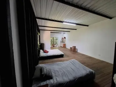 a bedroom with two beds in a room at Cabaña sol wifi jacuzzi charcos parking in Barbosa