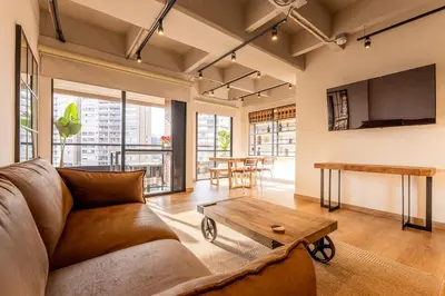 a living room with a couch and a table at Central, Modern Apartment in Envigado in Envigado