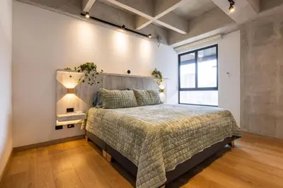 a bedroom with a large bed and a window at Spacious 2H Modern in Envigado in Envigado