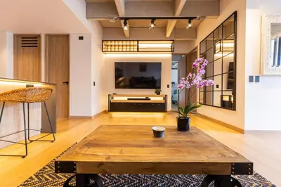 a living room with a coffee table and a tv at Spacious 2H Modern in Envigado in Envigado