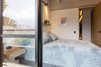 a bedroom with a bed and a window at Spacious 2H Modern in Envigado in Envigado