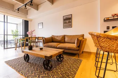 a living room with a couch and a table at Spacious 2H Modern in Envigado in Envigado