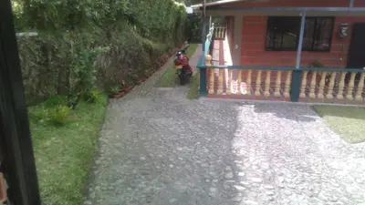 a motorcycle parked in front of a house at El descanso perfecto in Palestina