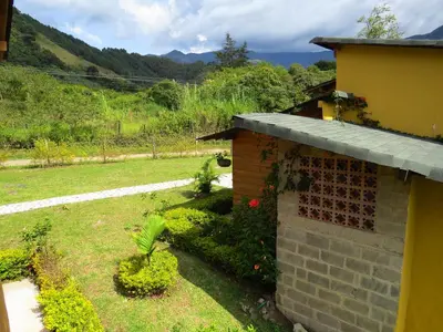 a backyard of a house with a garden at Jardín Utopía in Jardin