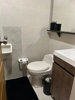 a bathroom with a toilet and a sink at Luxurious Stay 2 in Bello