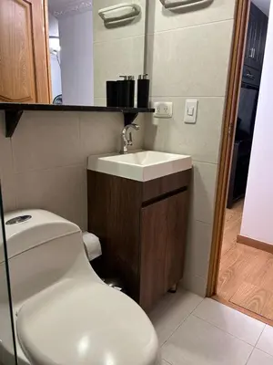 a bathroom with a white toilet and a sink at Luxurious Stay 2 in Bello