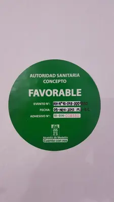 a green sign that readsynchronousynchronousynchronousynchronousynchronousynchronousynchronousynchronousynchronousynchronousynchronous at Purple Monkey Hostel in Medellín