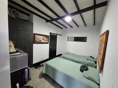 a bedroom with two beds in a room with a ceiling at Casa de lujo wifi jacuzzi charcos parking in Barbosa