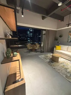 a living room with a couch and a table at Apto Bonito Poblado in Medellín