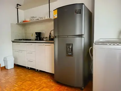 a stainless steel refrigerator in a kitchen at Céntrico Apartamento Belén in Medellín