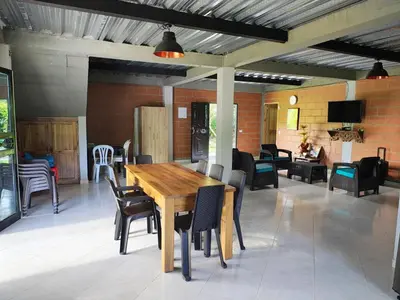 a dining room with a wooden table and chairs at Cabaña en San Rafael Cerca de Ríos y Naturaleza in San Rafael
