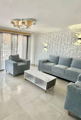 a living room with two couches and a coffee table at Apartamento central y espacioso in Marinilla