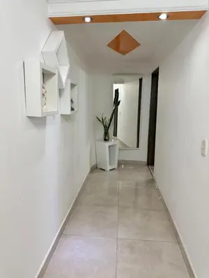 a hallway with white walls and a ceiling at Apartamento central y espacioso in Marinilla