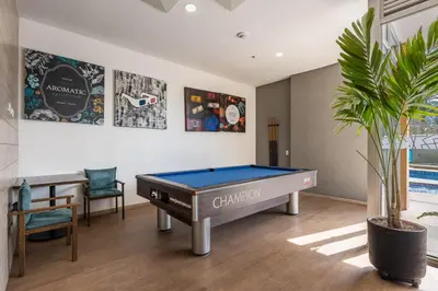 a living room with a pool table in it at El Poblado, Balcony, Pool, Jacuzzi, Gym, Steamroom in Medellín