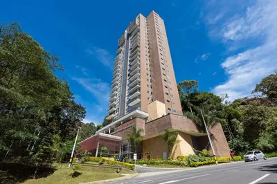 a tall building on the side of a road at El Poblado, Balcony, Pool, Jacuzzi, Gym, Steamroom in Medellín