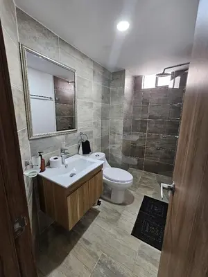 a bathroom with a sink and a toilet at Laureles Vibes Apto con estilo en Medellín 201 zona tranquila y cerca a todo in Medellín