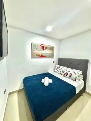 a bedroom with a bed with a stuffed animal on it at Apartamento Acogedor y Tranquilo in Sabaneta