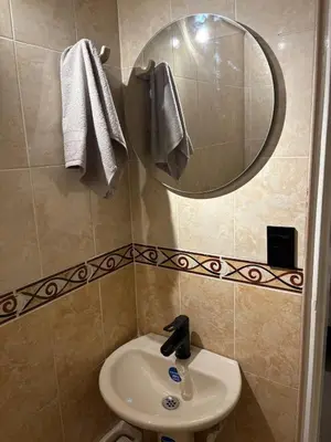 a bathroom with a sink and a mirror at Apartamento en centro de Medellín in Medellín