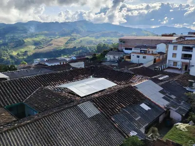 an overhead view of roofs with a tennis court on top at Hotel Posada La Porra in Concordia