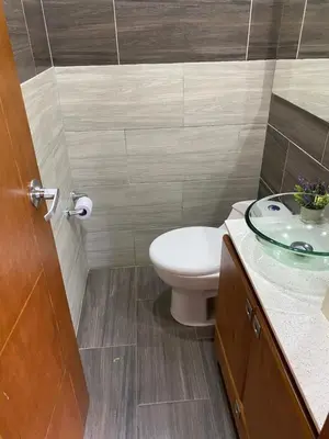 a bathroom with a toilet and a sink at Finca a 3 minutos aeropuerto jmc in Rionegro