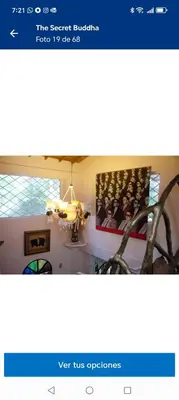 a page of a website with a picture of a group of people at Artsy lush villa with jungle garden in the city in La Estrella