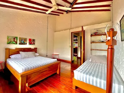 a bedroom with two beds in a room at Outstanding FarmHouse jacuzzi & pool near Medellin in Venecia