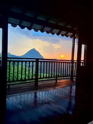 a view of the sunset from the deck of a house at Outstanding FarmHouse jacuzzi & pool near Medellin in Venecia