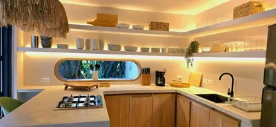 a kitchen with a sink and a counter top at Macondo House in Medellín