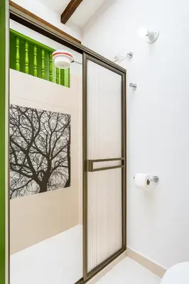 a shower with a glass door in a bathroom at Aluna Apartamento Jericó in Jericó
