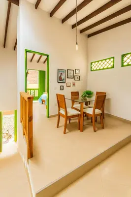 a dining room with a table and chairs at Aluna Apartamento Jericó in Jericó