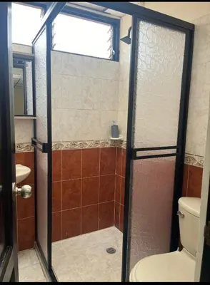 a bathroom with a shower and a toilet at La Vide es Bella in Supía