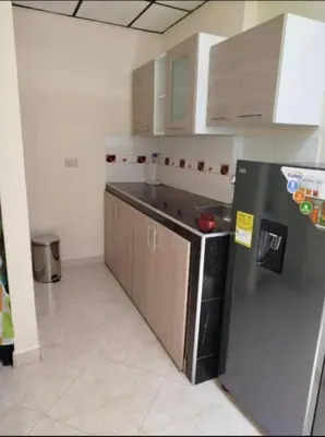 a kitchen with a refrigerator and a counter top at La Vide es Bella in Supía