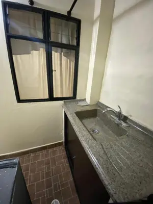 a bathroom with a sink and a window at Apartamento Central Envigado in Envigado