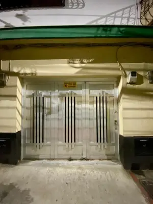 a garage door with a gate in a building at Apartamento Central Envigado in Envigado