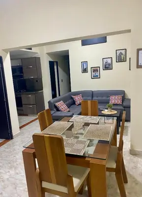 a living room with a table and a couch at Apartamento Central Envigado in Envigado