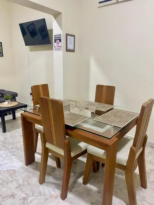 a dining room table with four chairs at Apartamento Central Envigado in Envigado