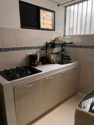 a kitchen with a stove and a sink at Apartamento en la mejor zona de buenos aires in Medellín