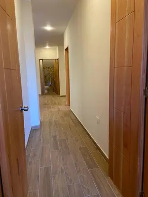 an empty hallway with wooden floors and a door at Casa Colonial Jericó - Casa Romo in Jericó