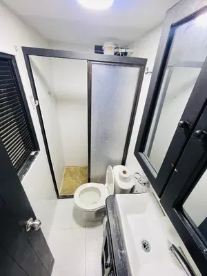 a small bathroom with a toilet and a sink at Hospedaje Mi casita in Guatapé
