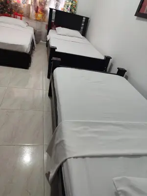 a row of three beds in a room at Casa Finca La Magdalena Pool and Warm Climate in Sopetran