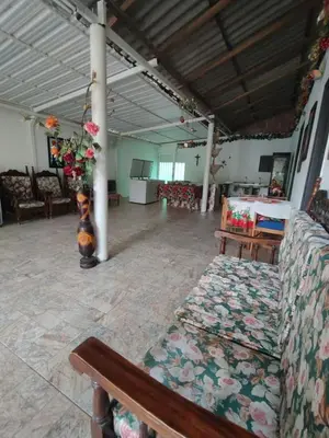 a large room with a couch and a vase of flowers at Casa Finca La Magdalena Pool and Warm Climate in Sopetran