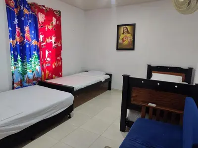 a room with two bunk beds and a christmas curtain at Casa Finca La Magdalena Pool and Warm Climate in Sopetran