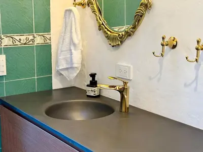a bathroom with a sink and a mirror at Elegant Colonial Walkable Casa in Jericó