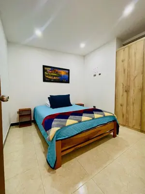 a bedroom with a bed in a room at Apartamento Privado en el Centro, Programación de Tours y Mas in Jardin