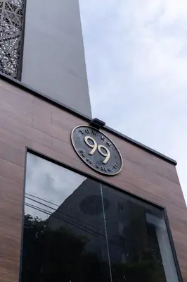 a sign on the side of a building at 99Rentall in Medellín