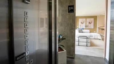 a view of a bedroom with a bed in a room at 99Rentall in Medellín