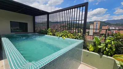a swimming pool on the roof of a building at BRENT 30 Living in Medellín