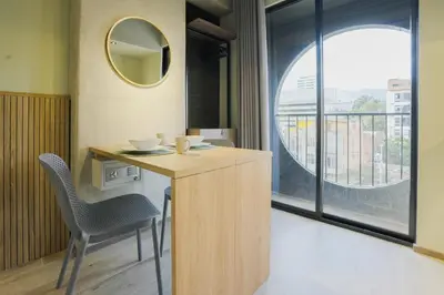a room with a table and a mirror and a window at BRENT 30 Living in Medellín
