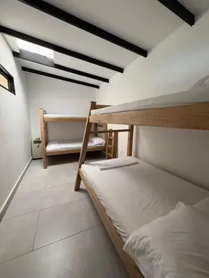 a bedroom with two bunk beds in a room at Finca, piscina y sin limite de sonido en Sopetran in Sopetran