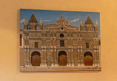 a picture of a building on the side of a wall at Hotel Boutique Lomas Colonial in Santa Fe de Antioquia